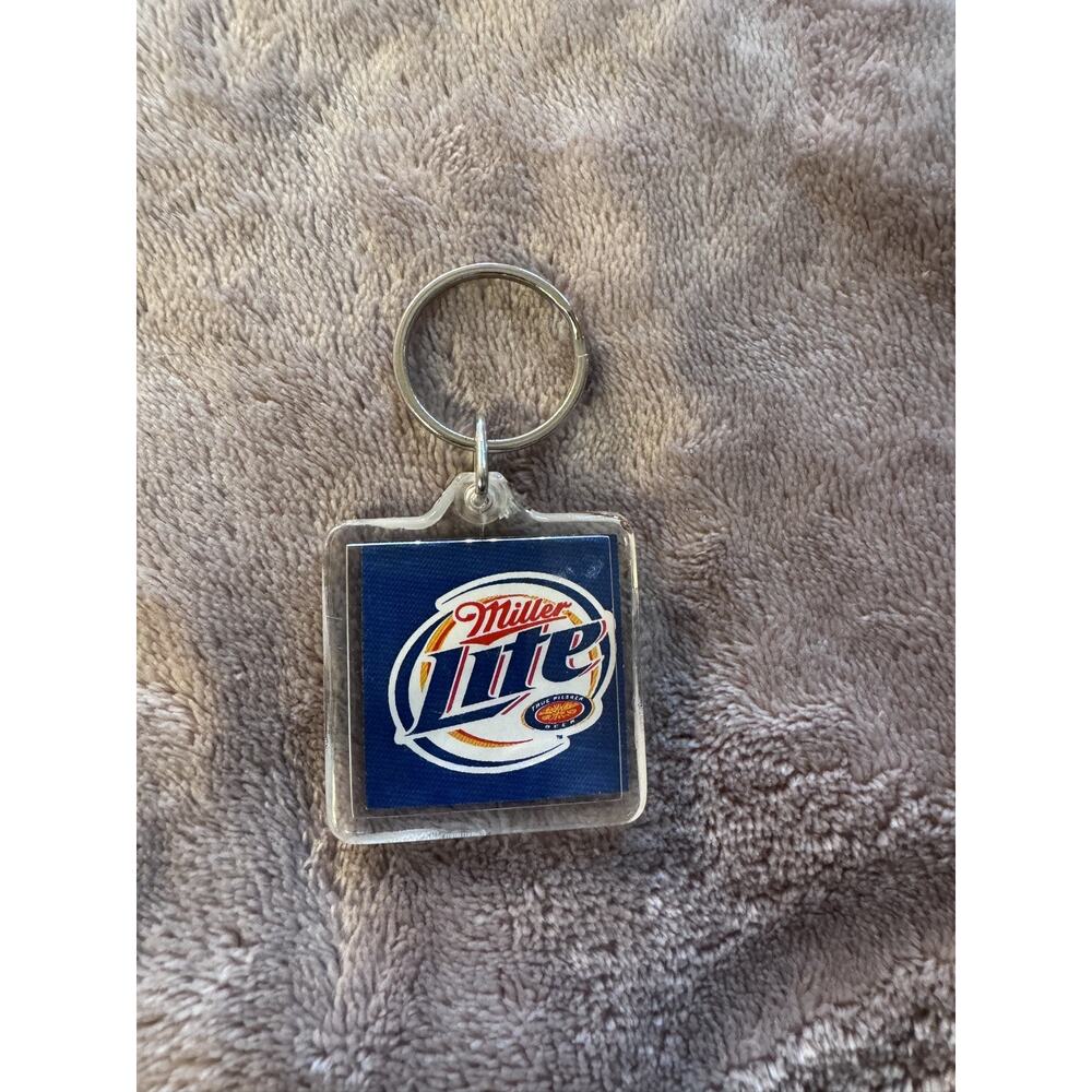 Miller Lite Key Ring Keychain Beer Advertising Logo on Dark Blue Background